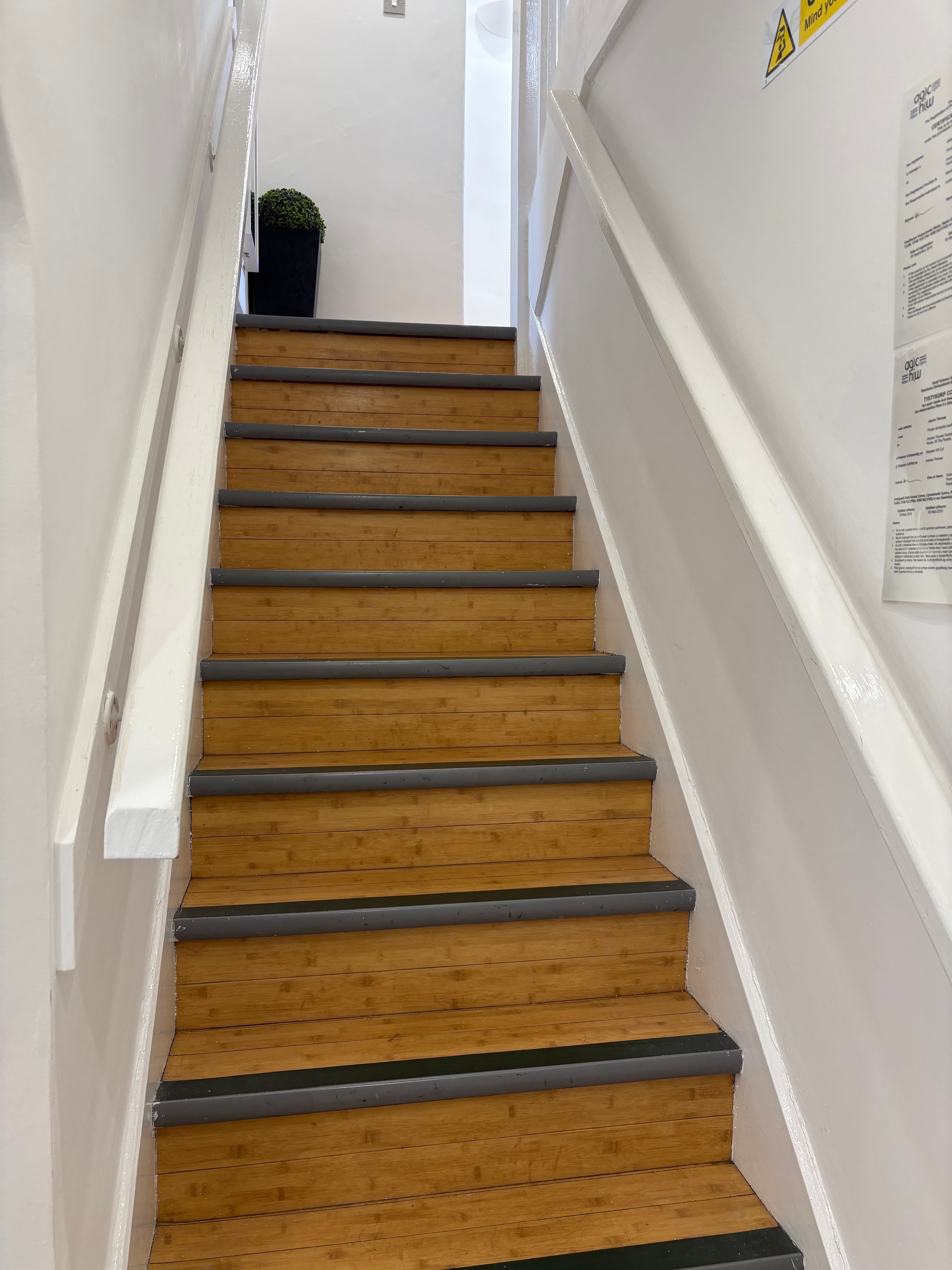 View looking up the staircase to the first floor practice